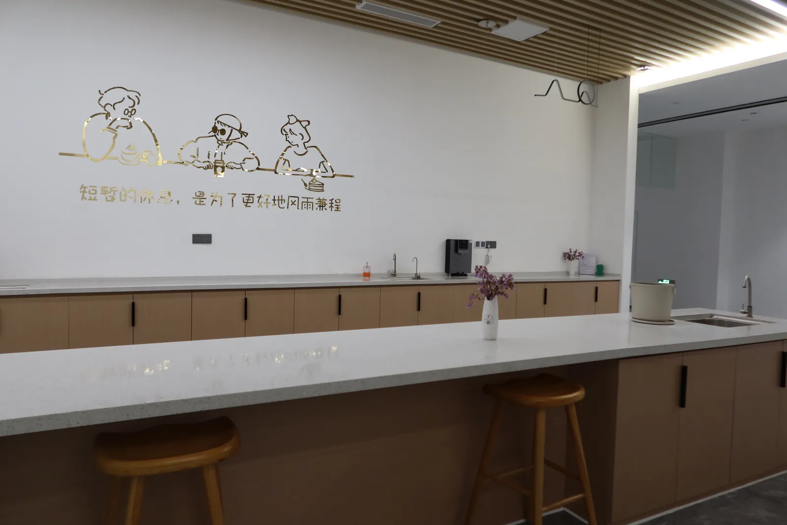 Kitchenette and rest area with bar stools